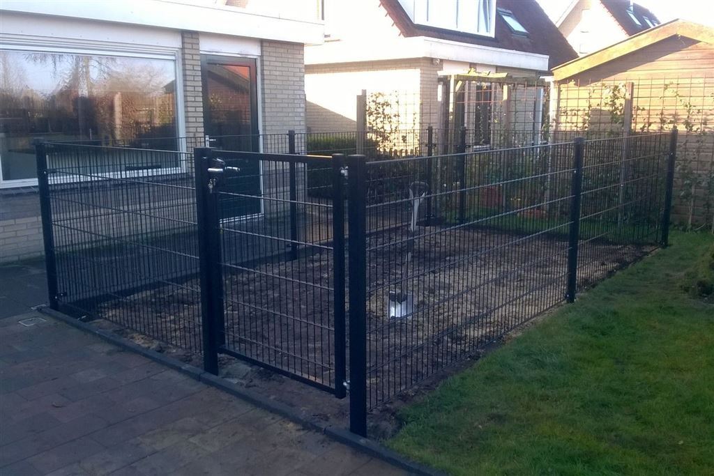 Afrastering of omheining tuin voor de hond